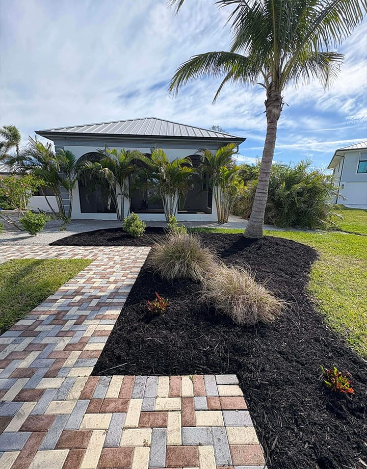 New mulch and rocks in the backyard planter beds of a Port Charlotte home.